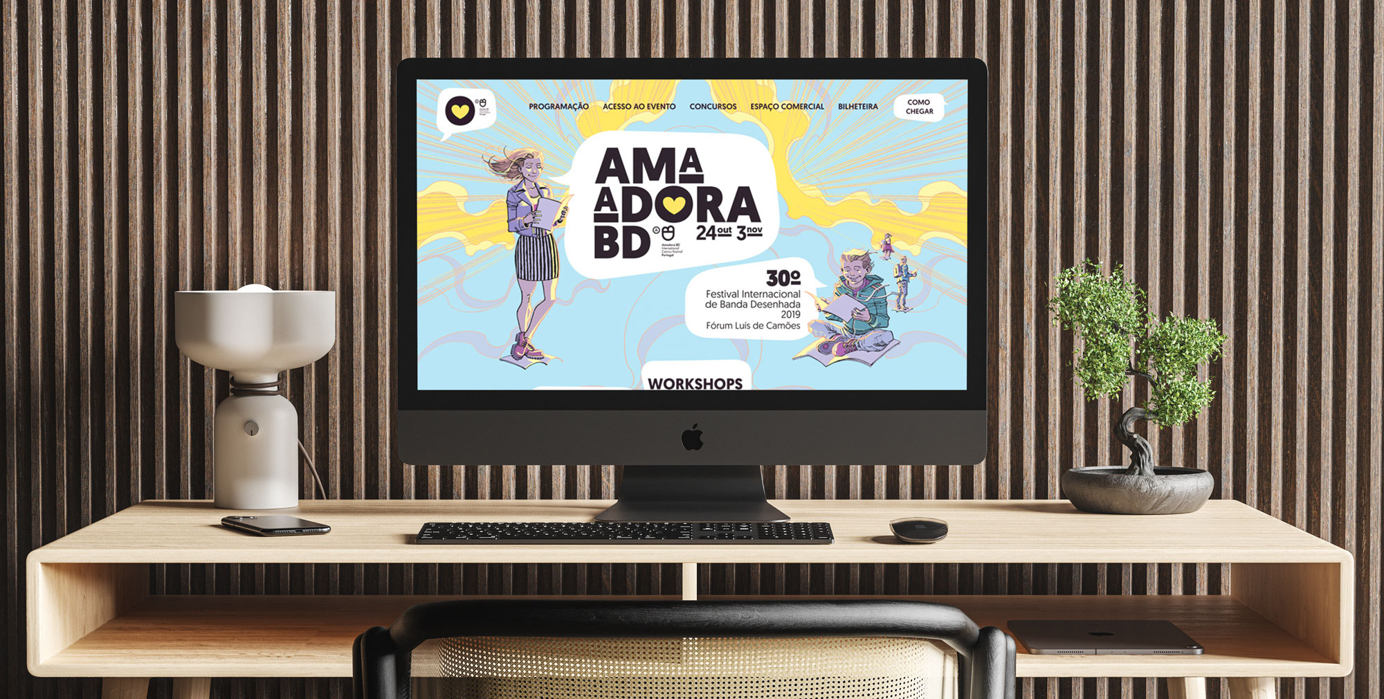 Mac Computer on a desk showing Amadora BD website