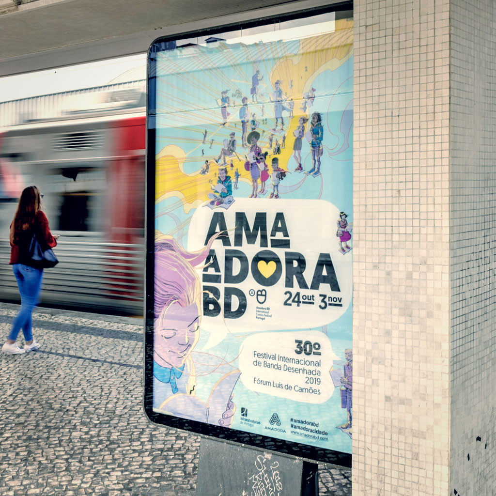 Outdoor advertising in a train station with a passing train in the background